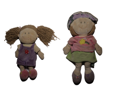 A picture of two dolls beside each other named 